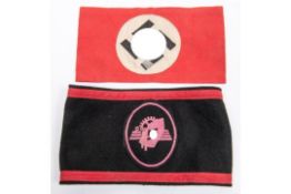 A Third Reich NSDAP armband, with applique swastika panel alloy number 4 and pip affixed; also an