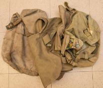 A large quantity of WWII webbing equipment, including pouches, belts, packs, cross straps, canvas