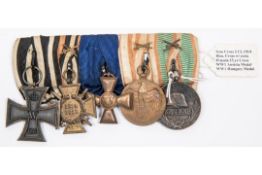 A WWI German group of medals: 1914 Iron Cross 2nd class, 1914-18 Honour Cross with swords, 15 year