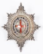 An officer's unmarked silver and enamel cap badge of the Coldstream Guards, the reverse with "J &