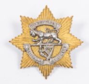 A good pre 1895 officers star pattern cap badge of the Leicestershire Regt, consisting of gilt