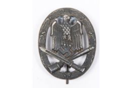 A Third Reich General Assault badge, dark finish, the flat back marked "Frank & Reif, Stuttgart"