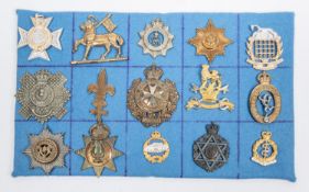 15 military badges, including cap badges of George V North Somerset Yeomanry, Trained Scout arm