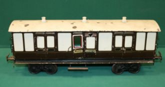 A rare Bing Gauge 3 L&NWR bogie Guards Van. 45cm, buffer to buffer, in lined dark brown and white