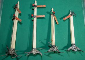 4 early Vintage Britains die cast metal and wood railway signals. Base is die cast metal with wooden