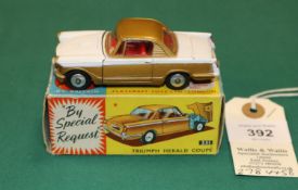 Corgi Toys Triumph Herald Coupe (231). In white and metallic gold with red interior, smooth wheels