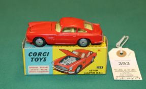 Corgi Toys Aston Martin DB4 (218). An example in red with yellow interior, open bonnet vent,