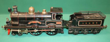 A rare Bing gauge 3 spirit fired L&NWR 4-4-0 tender locomotive. C.1902. Locomotive 39cm, 6 wheeled
