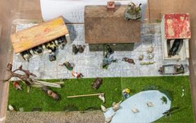 Britains farm yard diorama set. Bespoke and well made, with a wooden farm house, wooden cow shed,