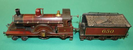 A rare early Bing O Gauge clockwork 4-2-2 tender locomotive. In the style of a Johnson Single with a