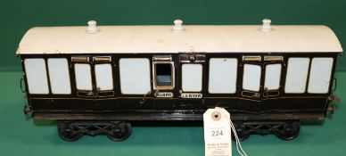 A rare Bing Gauge 3 L&NWR bogie Guards Van. 43cm, buffer to buffer, in lined dark brown and white