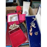 A box of costume jewellery with cigarette lighter, compact case and Clarins eyeshadow box
