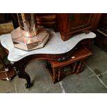A Victorian mahogany and marble top console table with cabriole legs and carved details