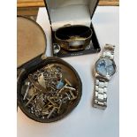 Two Accurist wrist watches and a small case containing cuff links and id bracelets