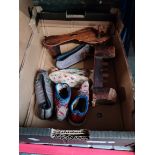 3 pairs of Chinese silk shoes and a pair of wooden shoes.