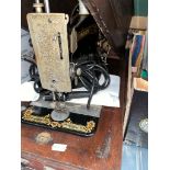 A converted hand crank sewing machine.