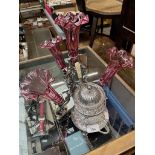 An epergne with four cranberry glass flutes, together with a glass jam pot on silver plated stand