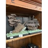 A pair of Pirates of the Caribbean bookends, modelled as pirate ships.