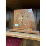 An oak cased Art Deco mantel clock.