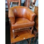 A tan leather Tetrad 'Heritage' tub chair.