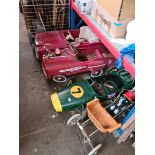 A group of four children's pedal vehicles.