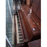 A Bentley mahogany cased overstrung upright piano.