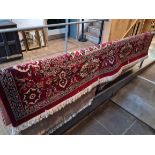 A Keshan style eastern wool carpet, red ground, 400cm x 300cm (approx).