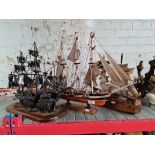 A metal pirate's ship, a bone / horn model boat and a wooden 3 masted ship.