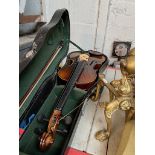 A student violin with bow, in hard case.