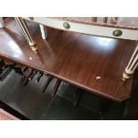 A Victorian wind out mahogany dining table and five chairs.
