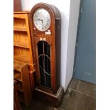 A 1930s Enfield Art Deco oak longcase clock.