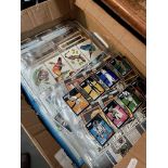 A box of cigarette cards, collectors cards including Star Wars and postcards.