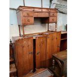 A suite of 1930s oak furniture comprising double wardrobe, gents wardrobe with fitted interior and