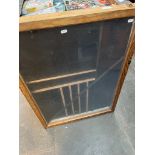 A table top glass display cabinet.