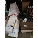 A Toyota electric sewing machine and a box of accessories.