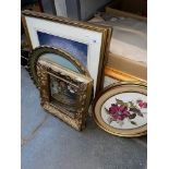 A collection of prints and a gilt frame.