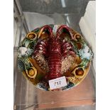 A vintage ceramic wall plaque featuring a 3-D lobster