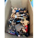 A box of wrestling figures.