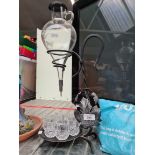 A spirit decanter with stag engraving and 6 cut glass glasses.