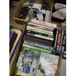 A box of darts, etc and a box of Xbox games, DVDs, etc.