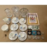 An Wedgwood part tea set, cut glass items, a Royal wedding programme,commemorative coins,2 £1 notes.