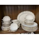 Dinner wares - 53 pieces by Edwardian Fine Bone China including soup coupes and stands, dinner