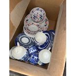 A box of dinner ware, including Churchill, willow pattern etc.