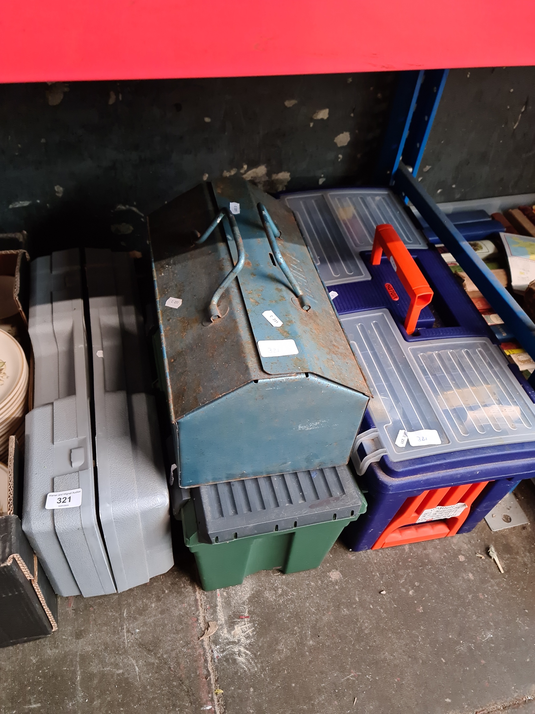 A box of tools, 2 toolboxes with contents and a boxed trolley jack.