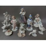 Nine Lladro and one Nao figures.