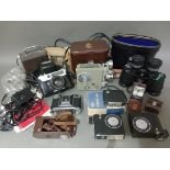 Assorted cameras including a Zeiss Ikon, a Yashica Lynx 5000E, a cine camera, various accessories