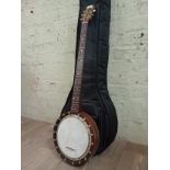 An inlaid walnut banjo in case.