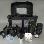 A Pentax IST D camera with lenses and accessories in bag.