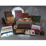 A box of assorted collectables including books, card games, doll's tea set, glass bottles, costume