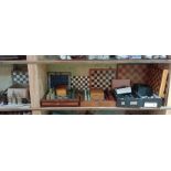 Seven chess sets, various materials and shapes together with boards, wooden boxes, etc.